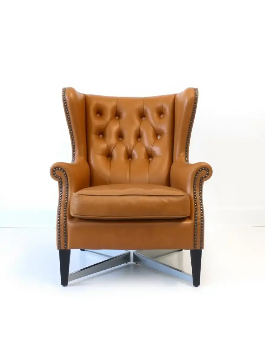Fauteuil club cuir fauve avec boutons capitonnés
